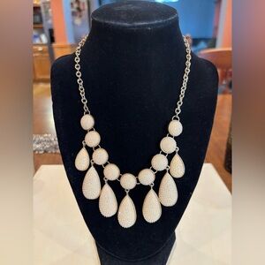 Necklace cream color acrylic tear drop and circle shapes. Adjustable 18” to 21”.